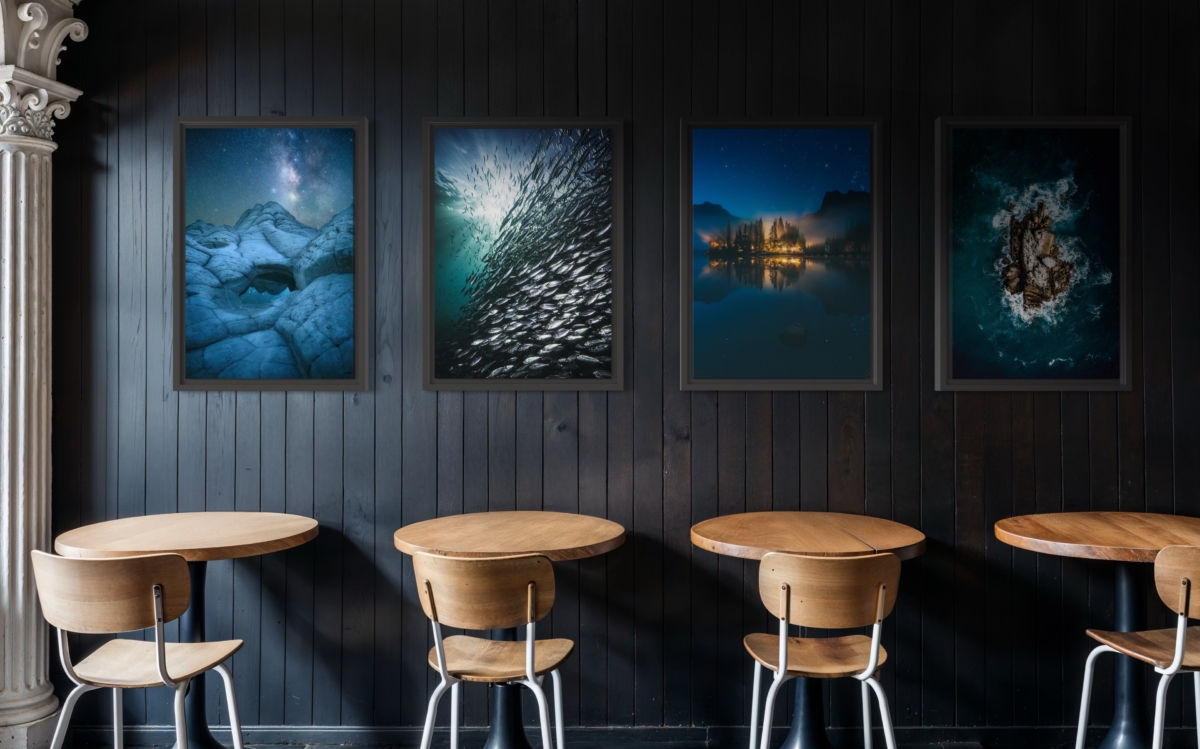 Limited edition photography prints by Jay Clue hanging on a restaurant wall. Featuring an image of the Milky Way night sky and underwater images.